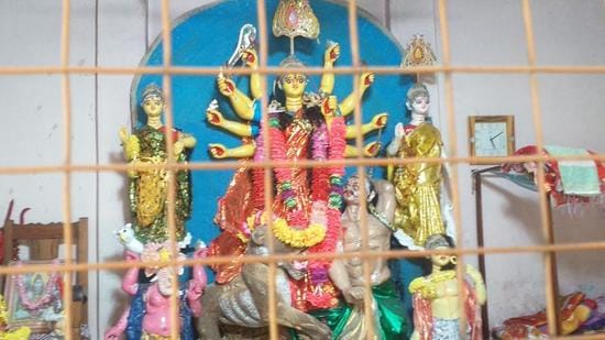 During Pujas, the BSF opens the border gate from 5:00 am to 10:00 pm every day and only devotees are allowed to enter the 150-year-old Durga Temple located in no-man’s land between India and Bangladesh near Assam’s Karimganj district. (HT PHOTO.)