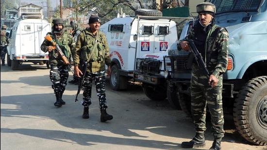 Security personnel stand guard as the National Investigation Agency (NIA) carry out raids in Anantnag on Sunday. (ANI PHOTO.) Security personnel stand guard as the National Investigation Agency (NIA) carry out raids in Anantnag on Sunday. (ANI PHOTO.)