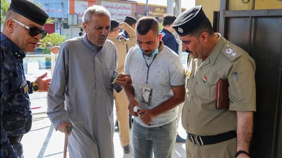 A senior Iraqi citizen arrives at a polling station in the multi-ethnic northern city of Kirkuk to vote in parliamentary elections on Sunday. (AFP)