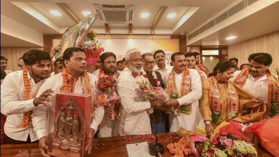 BKU leader Raju Ahlawat and others joining the BJP in Lucknow on Sunday. (PTI Photo)