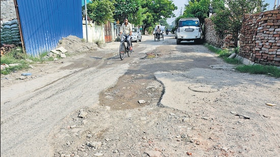 Potholed roads in Sarabha Nagar of Ludhiana which is one the areas chosen the smart city mission. (Harsimar Pal Singh/HT)