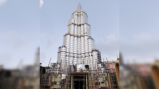 Durga puja pandal replicates Dubai's Burj Khalifa tower, at Lake Town in North 24 Parganas, Kolkata.(ANI)
