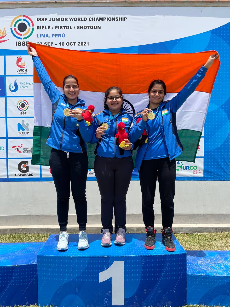 Naamya Kapoor (centre) after winning gold medal at ISSF Junior World Championships 2021 in Peru.