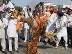 Farmers shout slogans against the three farm laws(AFP) Farmers shout slogans against the three farm laws(AFP)