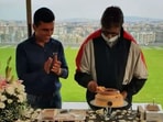 Amitabh Bachchan cuts birthday cake with Chehre producer Anand Pandit.(Instagram)