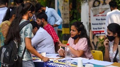 New Delhi, India - Oct. 5, 2021: Students seen at a help desk at Delhi University's north campus on the second day of admissions for 2021-22, in New Delhi , India, on Tuesday, October 5, 2021. (Photo by Amal KS / Hindustan Times) (Hindustan Times) New Delhi, India - Oct. 5, 2021: Students seen at a help desk at Delhi University's north campus on the second day of admissions for 2021-22, in New Delhi , India, on Tuesday, October 5, 2021. (Photo by Amal KS / Hindustan Times) (Hindustan Times)