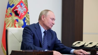 Russian President Vladimir Putin attends a meeting with members of the Security Council via a video link at his residence outside Moscow, Russia (via REUTERS)