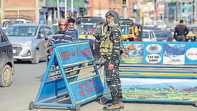 A member of security forces stands guard at a checkpoint in Srinagar, Jammu and Kashmir, on Monday. (PTI) A member of security forces stands guard at a checkpoint in Srinagar, Jammu and Kashmir, on Monday. (PTI)