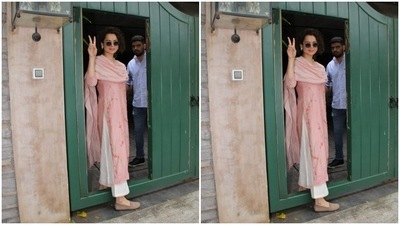 Kangana posed for the cameras. She teamed her look with tinted shades and nude ballerinas. (HT Photos/Varinder Chawla)