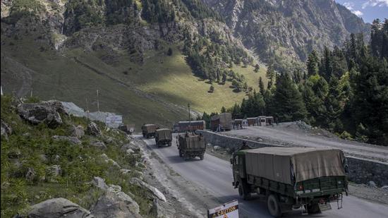 In this file photo, an Indian army convoy moves on the Srinagar-Ladakh highway at Gagangeer, northeast of Srinagar, Jammu and Kashmir. Indian and Chinese army commanders met on Sunday to discuss steps to disengage troops from key friction areas along their disputed border to ease a 17-month standoff. (AP) In this file photo, an Indian army convoy moves on the Srinagar-Ladakh highway at Gagangeer, northeast of Srinagar, Jammu and Kashmir. Indian and Chinese army commanders met on Sunday to discuss steps to disengage troops from key friction areas along their disputed border to ease a 17-month standoff. (AP)
