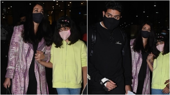 Aishwarya Rai Bachchan with her husband Abhishek Bachchan and their daughter Aaradhya arrived in Mumbai from Paris today. The couple was snapped at the airport early in the morning. They came to Mumbai right in time for Amitabh Bachchan's 79th birthday.(HT Photo/Varinder Chawla)