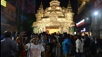 Devotees take pictures at a puja pandal during the Durga puja festival in Kolkata. (HT photo.) Devotees take pictures at a puja pandal during the Durga puja festival in Kolkata. (HT photo.)
