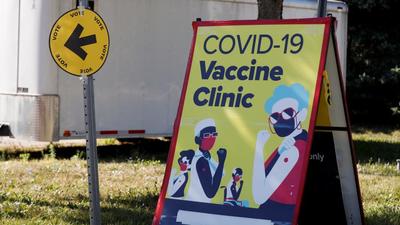 A Covid-19 vaccine clinic sign is seen in Kingston, Ontario, Canada. The country is bringing in vaccine mandates to tackle the coronavirus pandemic. (REUTERS) A Covid-19 vaccine clinic sign is seen in Kingston, Ontario, Canada. The country is bringing in vaccine mandates to tackle the coronavirus pandemic. (REUTERS)
