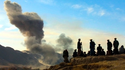 Northern Alliance soldiers watch as US air strikes attack Taliban positions in Kunduz province, Afghanistan. (AP) Northern Alliance soldiers watch as US air strikes attack Taliban positions in Kunduz province, Afghanistan. (AP)