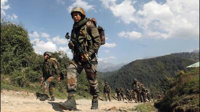 Security personnel patrol near the encounter site in Rajouri sector of Jammu and Kashmir on Tuesday. (ANI)