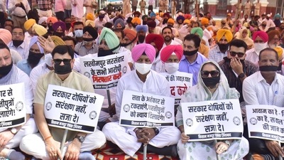Punjab Congress leaders during a ‘maun vrat’ protest against the Lakhimpur Kheri violence in Amritsar.