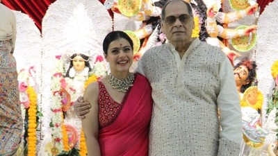 Kajol with her uncle at the Durga Puja pandal. She broke down when she met him and was seen sobbing and hugging him. (Varinder Chawla) 
