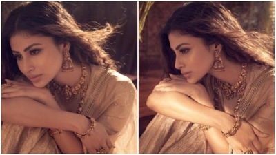 In the cream white lehenga, Mouni looked absolutely stunning. The lehenga consisted of a shimmery cream white long-sleeved blouse and a flowy skirt, teamed with an embroidered dupatta. (Instagram/@imouniroy) In the cream white lehenga, Mouni looked absolutely stunning. The lehenga consisted of a shimmery cream white long-sleeved blouse and a flowy skirt, teamed with an embroidered dupatta. (Instagram/@imouniroy)