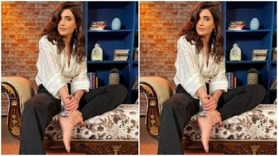 Karishma set the mood for her Instagram family with a ochre and white striped shirt and a pair of black trousers. (Instagram/@karishmaktanna)