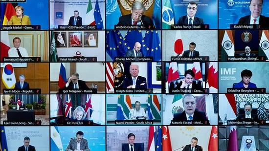 A screen displays world leaders as they take part virtually in an extraordinary G20 meeting on Afghanistan, in Rome, Italy on October 12, 2021. US President Joe Biden also attended the meeting. (via REUTERS)