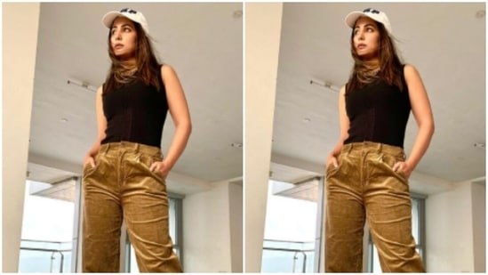 She tucked her tank top inside and folded her pants near the ankles and gave it a more casual vibe.(Instagram/@realhinakhan)