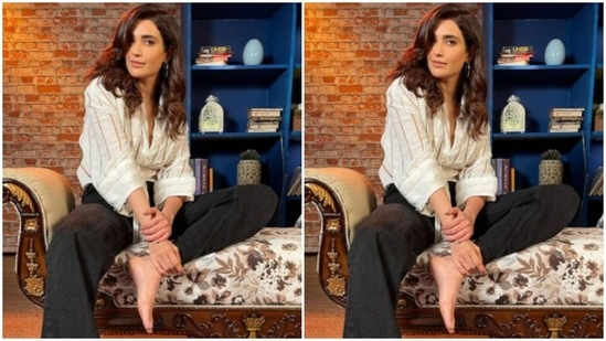 Karishma set the mood for her Instagram family with a ochre and white striped shirt and a pair of black trousers.(Instagram/@karishmaktanna)