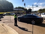 Officers allow a police vehicle to pass under yellow crime scene tape on a street in front of the post office in Memphis. Police said they are investigating a shooting at the post office in Tennessee. (AP Photo/Adrian Sainz) Officers allow a police vehicle to pass under yellow crime scene tape on a street in front of the post office in Memphis. Police said they are investigating a shooting at the post office in Tennessee. (AP Photo/Adrian Sainz)