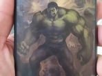 The photos, posted by the man's physician Dr Pedro Carvalho, show that the bullet indeed hit the Motorola smartphone, shattering its screen, but was ultimately stopped by the Incredible Hulk-themed cover. (Photo via @Oparbento1 on Twitter) The photos, posted by the man's physician Dr Pedro Carvalho, show that the bullet indeed hit the Motorola smartphone, shattering its screen, but was ultimately stopped by the Incredible Hulk-themed cover. (Photo via @Oparbento1 on Twitter)