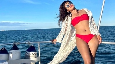 Priyanka Chopra relaxing in red bikini. (Instagram) Priyanka Chopra relaxing in red bikini. (Instagram)