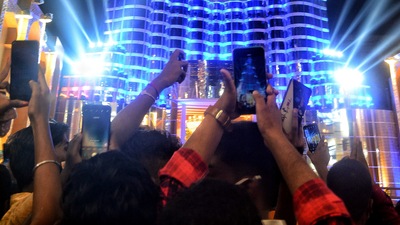 Devotees take pictures of Dubai's Burj Khalifa tower pandal created by Kolkata’s Sreebhumi Sporting Club as the Durga Puja celebration commences in Kolkata. (ANI) Devotees take pictures of Dubai's Burj Khalifa tower pandal created by Kolkata’s Sreebhumi Sporting Club as the Durga Puja celebration commences in Kolkata. (ANI)