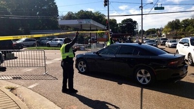 Officers allow a police vehicle to pass under yellow crime scene tape on a street in front of the post office in Memphis. Police said they are investigating a shooting at the post office in Tennessee. (AP Photo/Adrian Sainz) Officers allow a police vehicle to pass under yellow crime scene tape on a street in front of the post office in Memphis. Police said they are investigating a shooting at the post office in Tennessee. (AP Photo/Adrian Sainz)