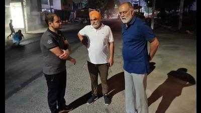The LIT officials checked the quality of hot mix material and the thickness of the under-construction road. (HT Photo )