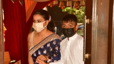 Kajol with her son Yug at a puja pandal in Mumbai. Kajol with her son Yug at a puja pandal in Mumbai.