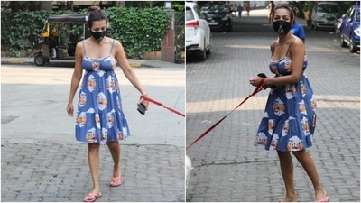 Malaika, who is dating Arjun Kapoor, kept things simple for her outing. She chose a pretty knee-length summer dress in a pleasing light blue shade and looked incredible as always. (HT Photo/Varinder Chawla)
