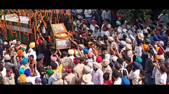 The coffin carrying the mortal remains of naib subedar Jaswinder Singh, who was slain in the Poonch encounter, arrive at his native village Mana Talwandi in Kapurthala district.