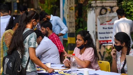 New Delhi, India - Oct. 5, 2021: Students seen at a help desk at Delhi University's north campus on the second day of admissions for 2021-22, in New Delhi , India, on Tuesday, October 5, 2021. (Photo by Amal KS / Hindustan Times) (Hindustan Times)