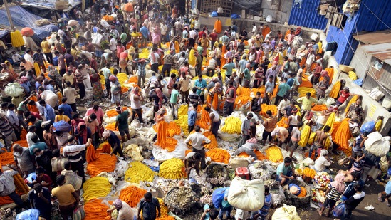 Devotees throng a market in Kolkata to buy flowers on the occasion of Maha Saptami of Durga Puja festival on October 12.(ANI)