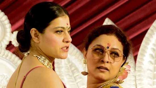 Actor Sarbani Mukherjee and Kajol posed for the paparazzi.(AFP)