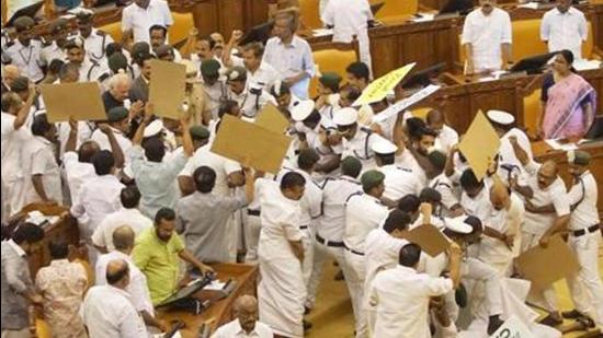 In March, 2015, the Kerala assembly witnessed violent incidents after then opposition LDF legislators tried to prevent finance minister KM Mani from presenting the budget alleging his role in the 2014 bar bribery case. (HT File)