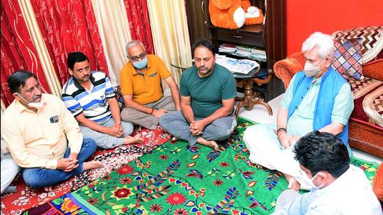 Jammu and Kashmir L-G Manoj Sinha interacts with the bereaved family members of the schoolteacher who was killed by militants, in Jammu on Wednesday. (ANI) Jammu and Kashmir L-G Manoj Sinha interacts with the bereaved family members of the schoolteacher who was killed by militants, in Jammu on Wednesday. (ANI)
