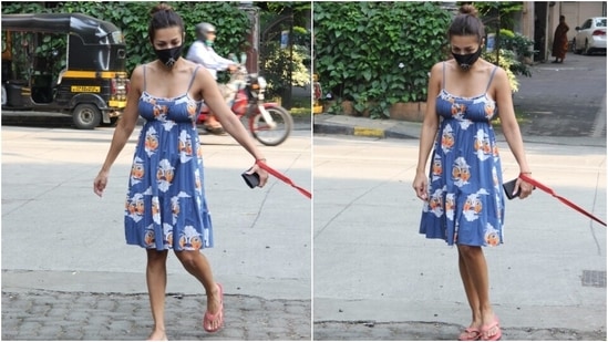 Malaika's spaghetti-strapped dress came adorned with whimsical patterns in white, orange, pink and blue shades. It featured cinched-in detail at the torso, pre-pleated fall, and a fit-and-flare silhouette that added a dreamy vibe.(HT Photo/Varinder Chawla)
