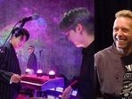 (L) BTS members Jungkook and Suga trying their hand on the drums, (R) Coldplay's Chris Martin with Jin. (L) BTS members Jungkook and Suga trying their hand on the drums, (R) Coldplay's Chris Martin with Jin.