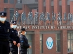 Security personnel keep watch outside Wuhan Institute of Virology during the visit by the World Health Organization (WHO) team tasked with investigating the origins of the coronavirus disease (Covid-19), in&nbsp;Wuhan, Hubei province, China