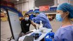 A resident receives the Sinopharm Covid-19 vaccine in Wuhan in China's central Hubei province on October 14, 2021. The WHO has set up a new virus origin probe team. (AFP) A resident receives the Sinopharm Covid-19 vaccine in Wuhan in China's central Hubei province on October 14, 2021. The WHO has set up a new virus origin probe team. (AFP)