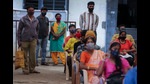 People wait to receive the vaccine for COVID-19 at a vaccination center set up at a government run school in Bengaluru (AP) People wait to receive the vaccine for COVID-19 at a vaccination center set up at a government run school in Bengaluru (AP)
