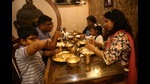 Foodies from all over Delhi-NCR are trying authentic Bengali dishes in CR Park, as food stalls and bhog at Durga Puja pandals remain subjected to COVID restrictions this year as well. (Photo: Raajessh Kashyap/HT) Foodies from all over Delhi-NCR are trying authentic Bengali dishes in CR Park, as food stalls and bhog at Durga Puja pandals remain subjected to COVID restrictions this year as well. (Photo: Raajessh Kashyap/HT)