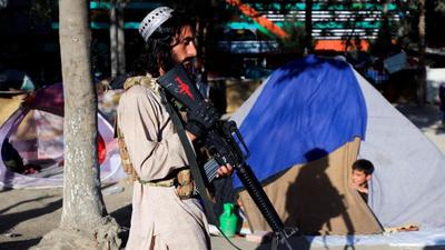 A Taliban fighter walks past the tents of a displaced family fleeing the violence in their province at Shahr-e Naw park, in Kabul, Afghanistan, October 14, 2021. REUTERS/Zohra Bensemra (REUTERS) A Taliban fighter walks past the tents of a displaced family fleeing the violence in their province at Shahr-e Naw park, in Kabul, Afghanistan, October 14, 2021. REUTERS/Zohra Bensemra (REUTERS)