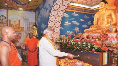Prime Minister Narendra Modi praying before Lord Buddha at Bodh Gaya. (AFP File Photo) Prime Minister Narendra Modi praying before Lord Buddha at Bodh Gaya. (AFP File Photo)