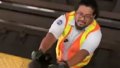 Man rescues cat from getting crushed under the train. (Instagram/@goodnews_movement) Man rescues cat from getting crushed under the train. (Instagram/@goodnews_movement)