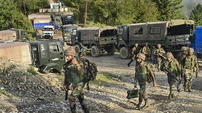 Security personnel patrol at the site of an encounter in Surankote area of Poonch district, on Monday. On October 12, five army personnel, including a Junior Commissioned Officer (JCO), were killed during an anti-insurgency operation. (PTI)